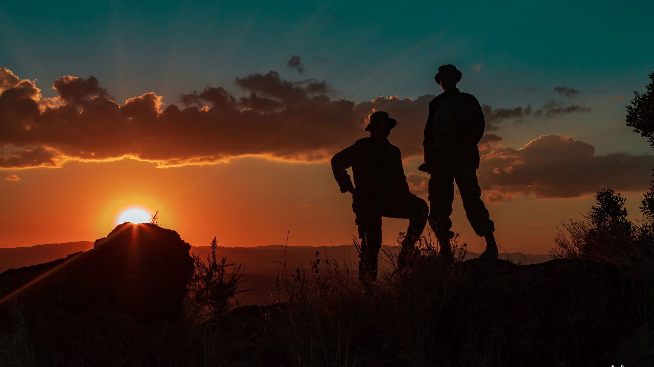 Rangers during sunset on Lewa
